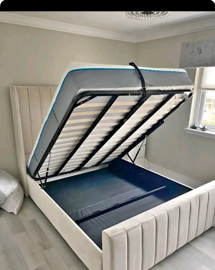 Cream Panel Wing bed with ottoman storage open